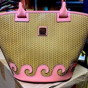 Pink and tan Dooney Bourke purse. Never used. No tags.